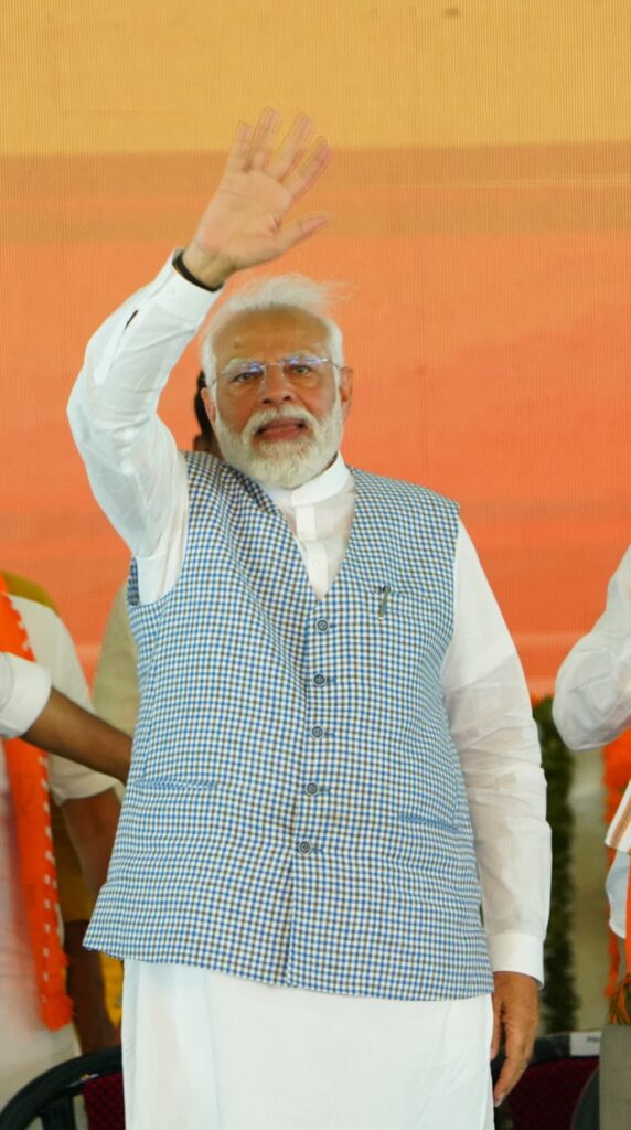 Modi waving